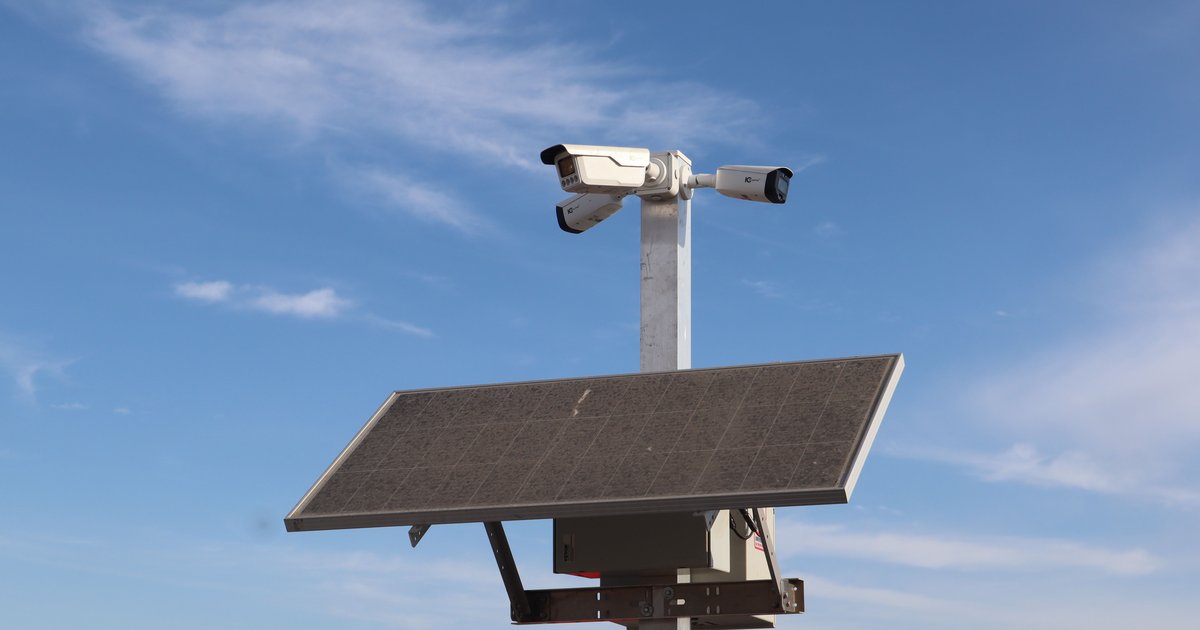 A street-mounted ALPR camera scanning passing vehicles, representing an ALPR camera search and lookup system