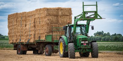 Farmer using tractor to respond to illegal parking blocking a rural field gate entrance