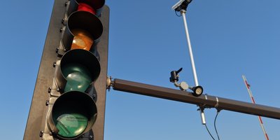 A Flock Safety ALPR camera mounted on a street pole, part of a flock camera map network