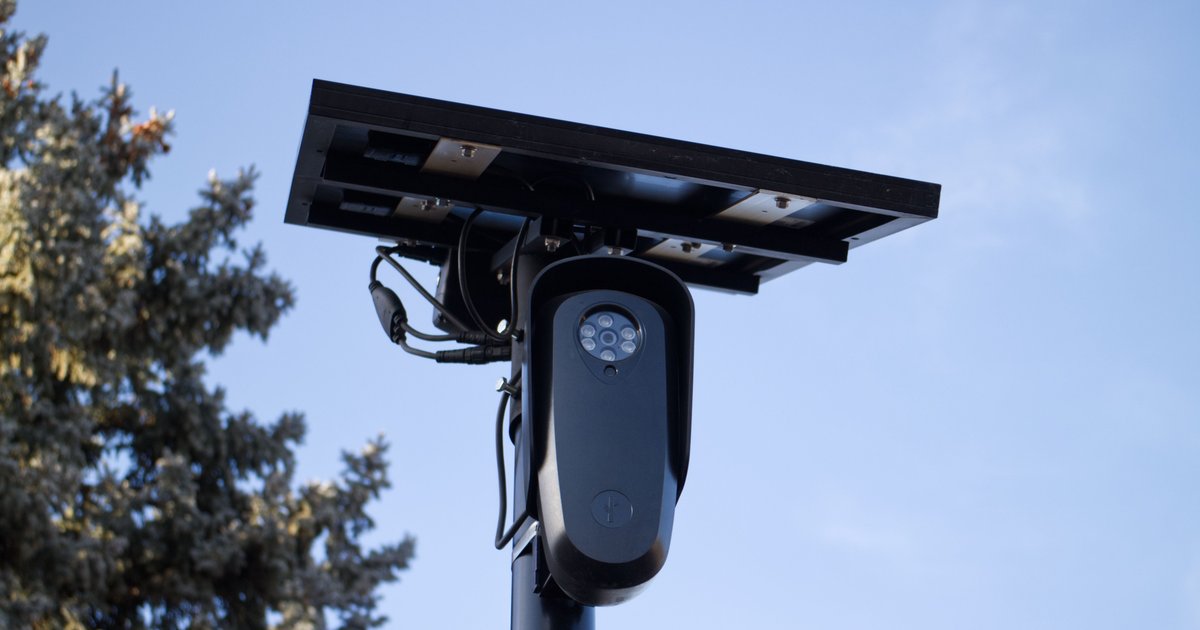 Automated license plate reader camera mounted on a pole, representing the Flock license plate database lookup topic.