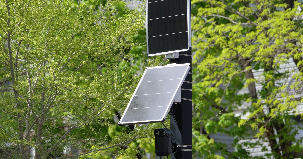 A Flock Safety automated license plate reader camera mounted on a roadside pole at the center of a privacy lawsuit.