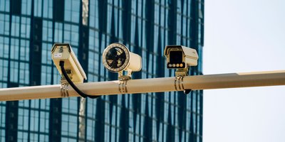 A Flock Safety ALPR camera mounted on a roadside pole showing how Flock cameras work