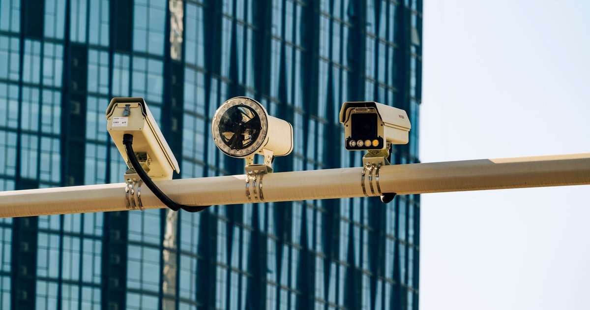 A Flock Safety ALPR camera mounted on a roadside pole showing how Flock cameras work