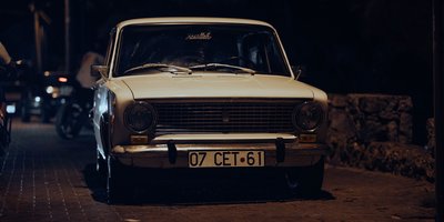 Close-up of a LURKER vanity plate on a car bumper illustrating the lurker meaning in internet culture