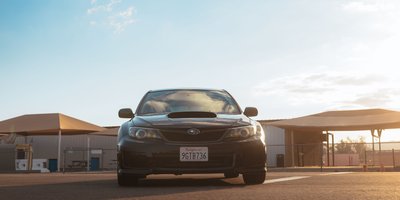 Close-up of a Minnesota license plate on a parked car used for a Minnesota license plate lookup guide