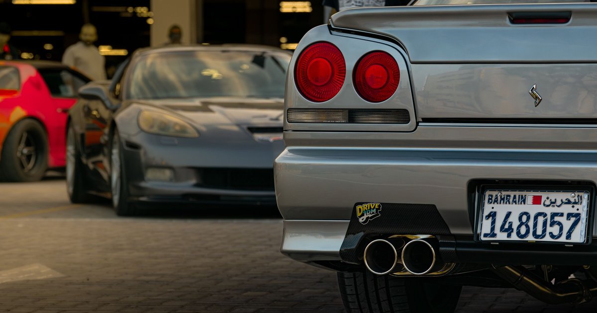 Close-up of a personalized vanity license plate on the back of a parked car